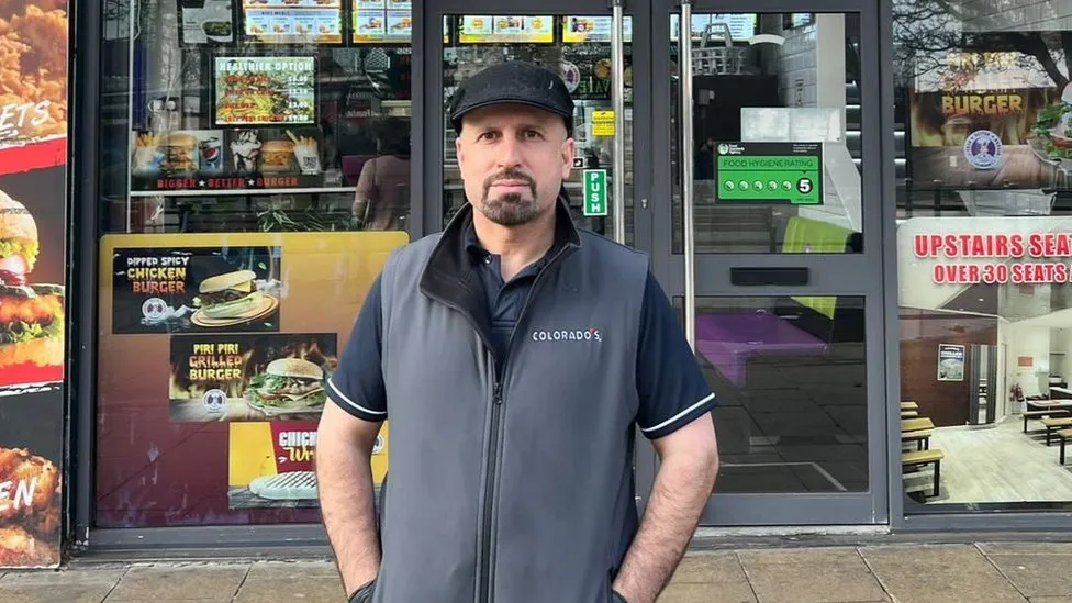 Ali outside his chicken shop Source: BBC