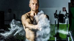 Well-built man with chalk