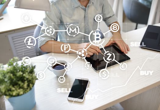 A bitcoin on a computer keyboard