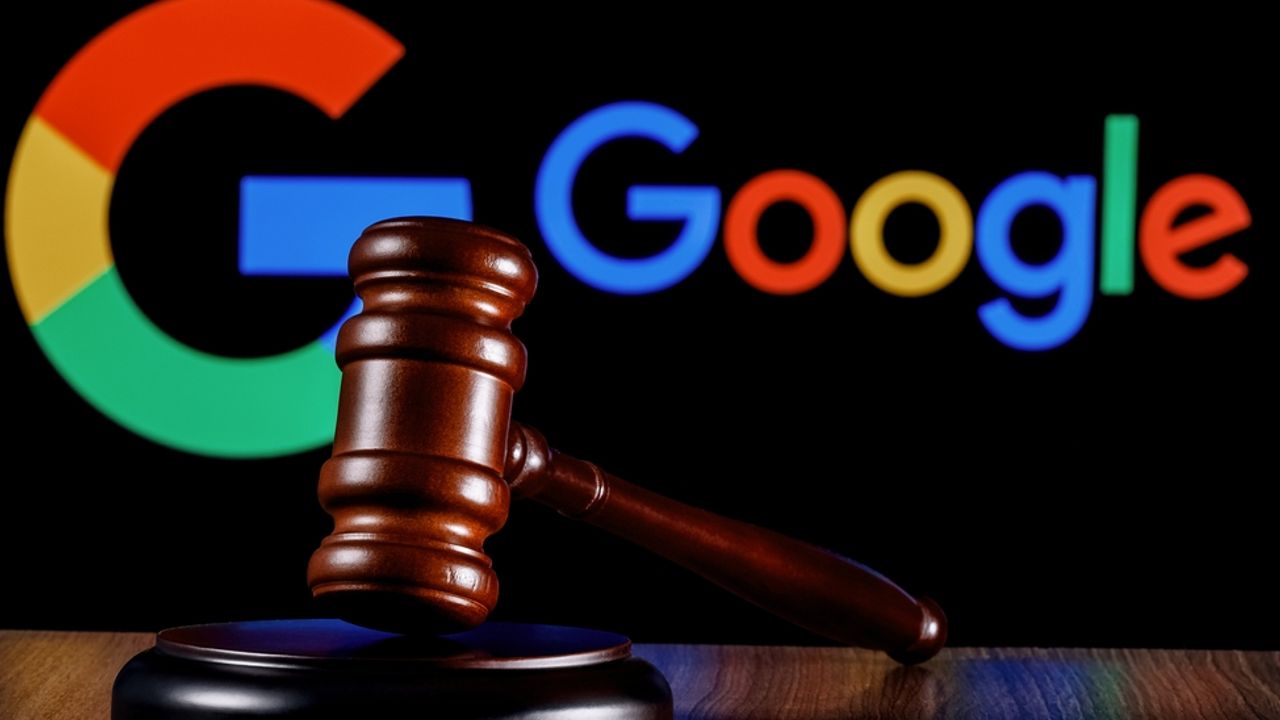Gavel on table against the background of Google technology company logo.
