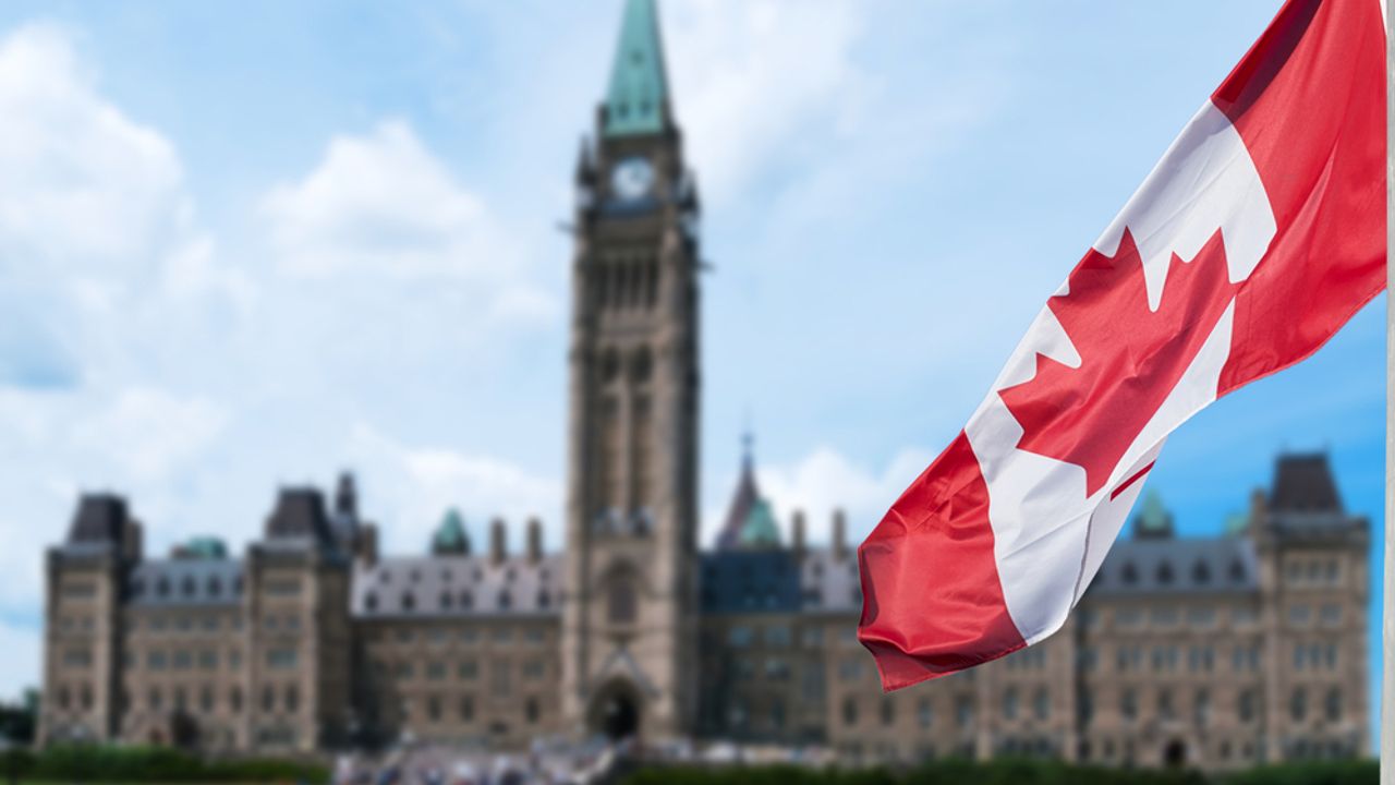 Canadian flag and parliament building