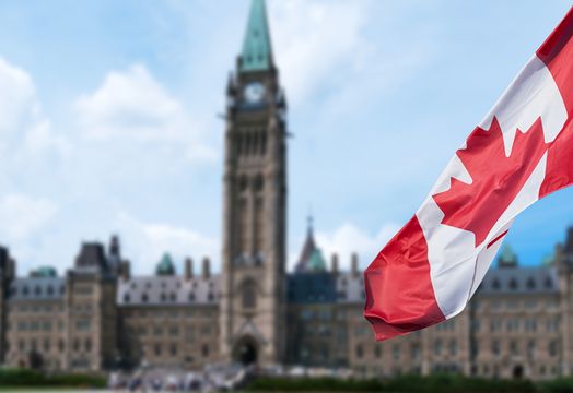 Canadian flag and parliament building