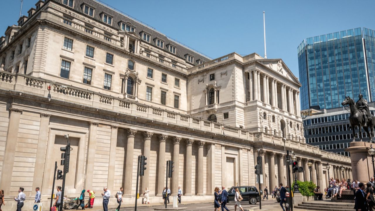 Bank of England cuts interest rates and lowers inflation forecast