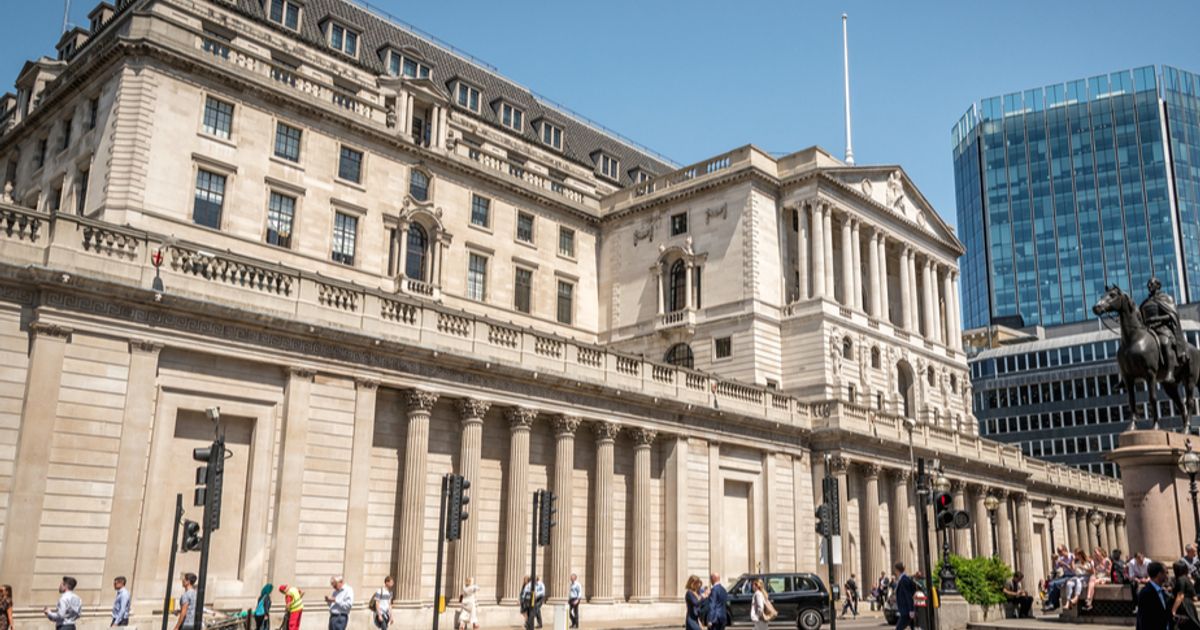 Bank of England cuts interest rates and lowers inflation forecast