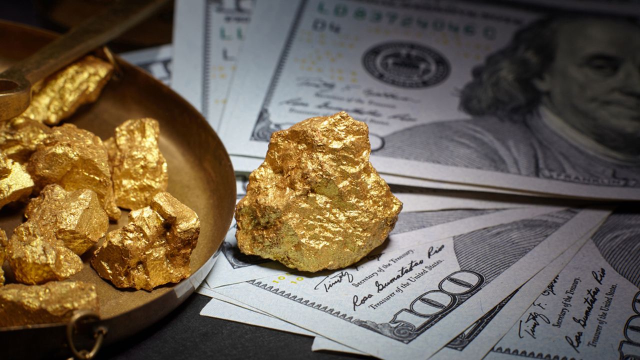 nugget-gold-and-dollar-bills-business-concept