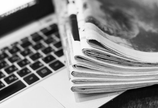 Newspapers and laptop