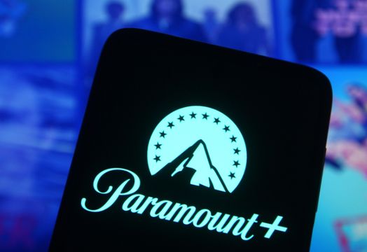 Paramount logo on a phone in front of other screen