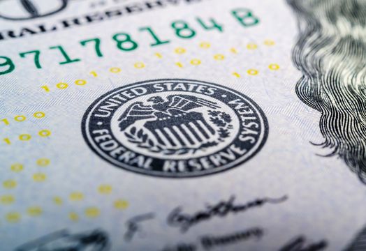 Fed logo on a dollar bill
