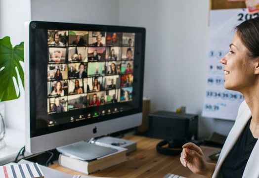 young woman having Zoom video conference call via computer