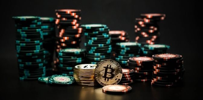 Bitcoin in front of poker chips